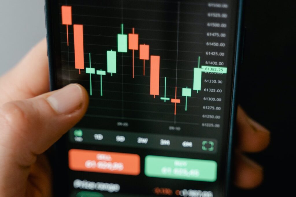 Close up image of a mobile screen with stock chart image